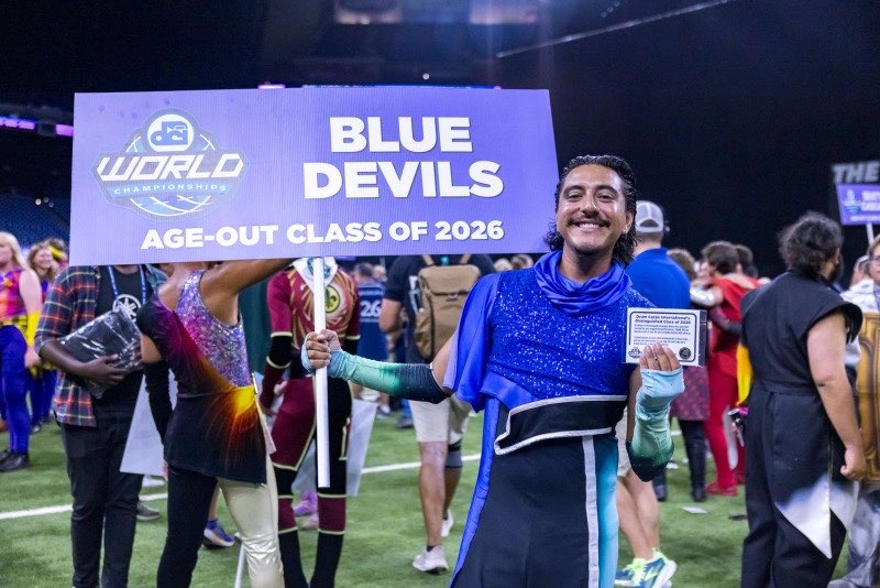 seb holding a Blue Devils age-out sign