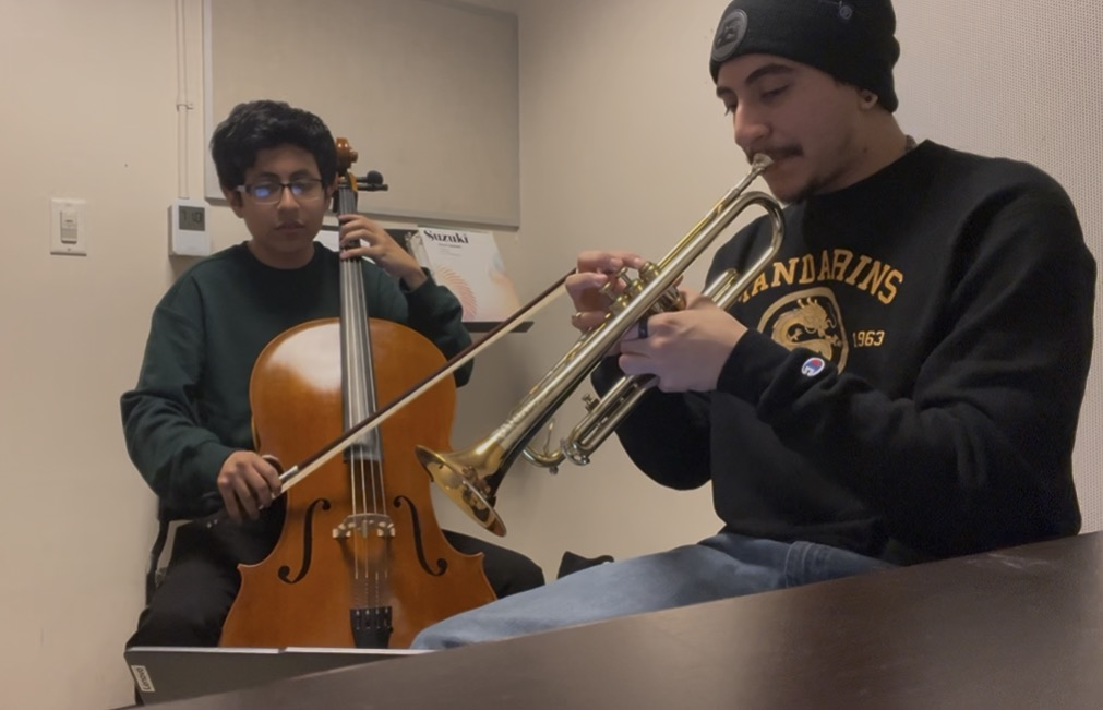 seb playing trumpet with a cellist